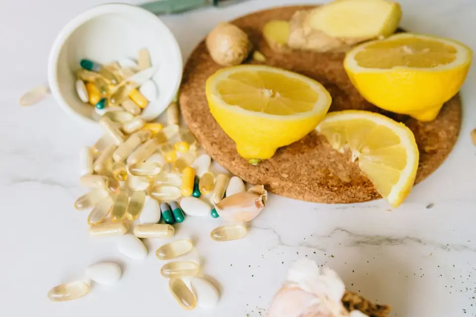 Fish oil softgel capsules next to a bowl of dog food